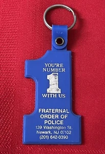 VTG BLUE FRATERNAL ORDER OF POLICE YOU’RE NUMBER 1 WITH US  KEYCHAIN NEWARK, NJ - Picture 1 of 5