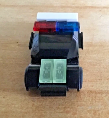 LEGO RACERS: Tiny Turbos Police Car (7611) - Retired - Polybag Set- Glow In Dark - Image 1 of 4