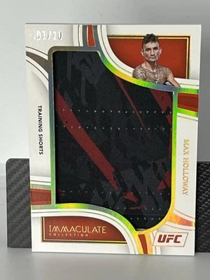 2023 Panini UFC Immaculate Max Holloway Gold 01/10 Training Shorts Patch Bookend - Image 1 of 3