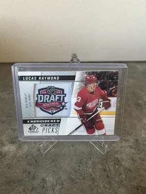 21/22 2021 SP GAME USED LUCAS RAYMOND #92 EMBROIDERED DRAFT PICKS DETROIT WINGS - Image 1 of 2