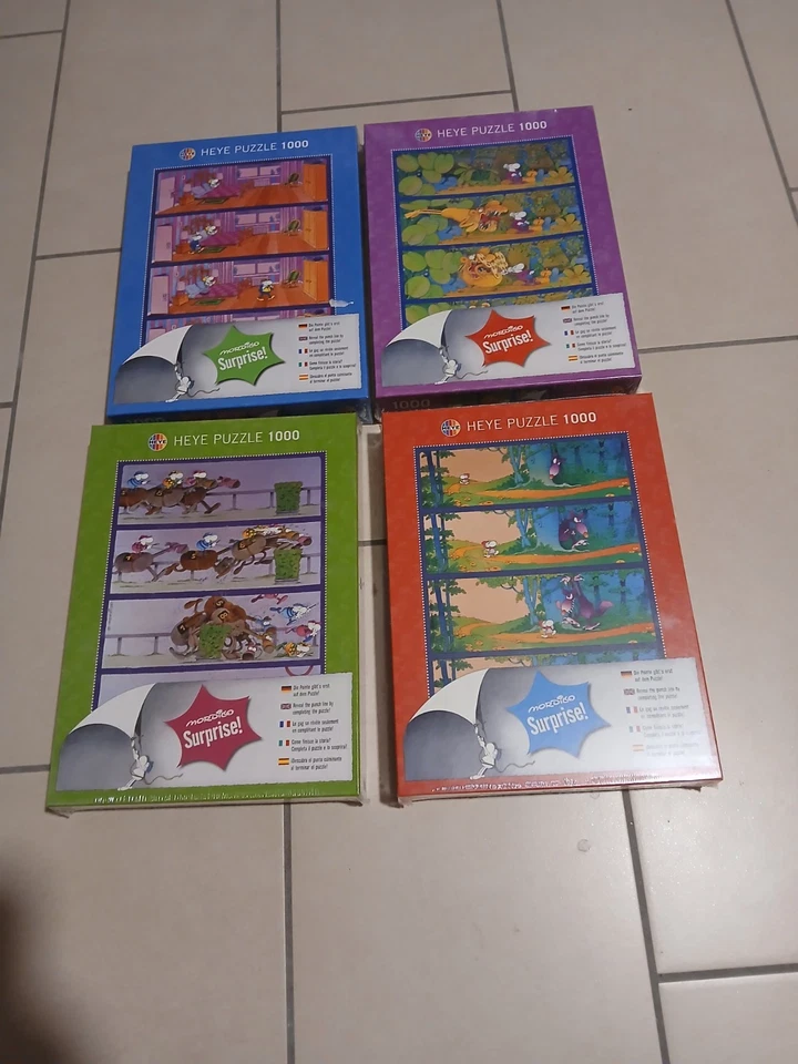 Set di 4 Puzzle Heye 1000 Pezzi Mordillo Surprise Nuovi - Immagine 1 di 2