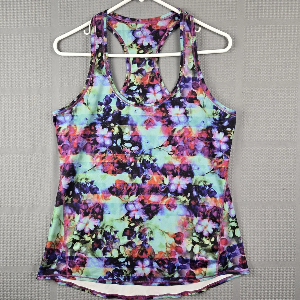 Camiseta sin mangas atlética Athleta para mujer floral colorida púrpura elástica espalda deportiva talla M Foto 1 de 4