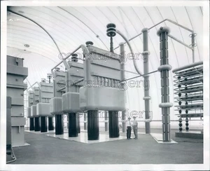 1963 Press Photo Men Dwarfed by Huge Allis Chalmers Rectifier Transformers - Picture 1 of 2