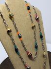Fun glass bead and metal necklace. Bright and cheerful. 24” long w/pendant. N11