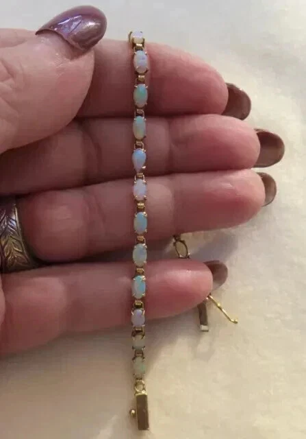 Brazalete de tenis para mujer Fire Opal ovalado creado en laboratorio de 7" enchapado en oro amarillo de 14K Foto 1 de 4