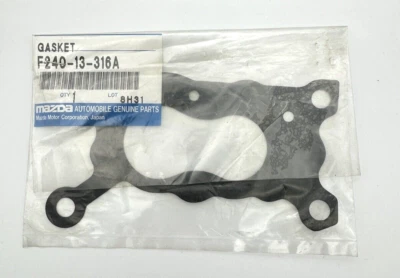 Прокладка основания карбюратора подлинная от оригинального производителя Mazda B2200 B2600 F240-13-316A сделано в Японии - Изображение 1 из 2