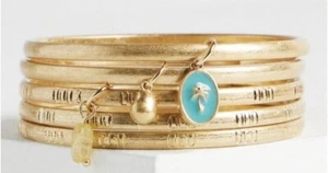 Brazles dorados marca Torrid con dijes - Imagen 1 de 2