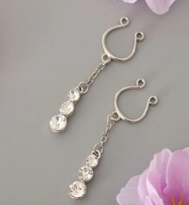 1 par de anillos piercing falsos para pezones colgantes de cristal de acero inoxidable con clip Foto 1 de 4