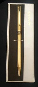 PENNA A SFERA AURORA MARCO POLO RETRATTILE, PLACCATA ORO, CUSTODIA ORIGINALE c1985 vg - Foto 1 di 7