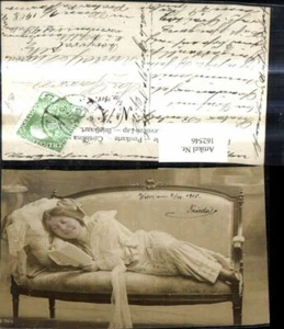 162546,Frau liest liegend Brief a. Sofa Bank  - Picture 1 of 1