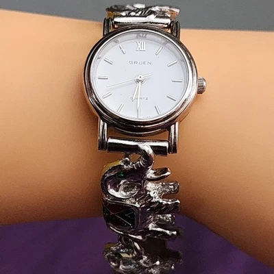 Reloj analógico para dama Gruen 8150 tono plateado con correa de elefantes batería nueva funciona Foto 1 de 4