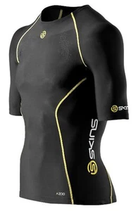 SKINS A200 YOUTH COMPRESSION SHORT SLEEVE TOP - BLACK / YELLOW | BRAND NEW - Picture 1 of 2