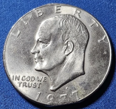 A 1977 D Eisenhower Dollar clipped planchet error - Image 1 of 2