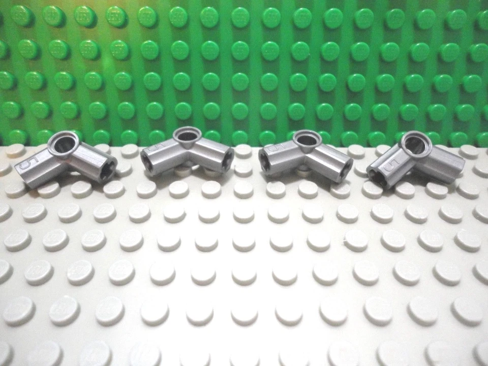Lego 4 Flat Silver technic axle and pin connector #5 NEW - Image 1 of 1