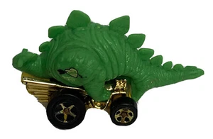 Hot Wheels Stegosaurus 1994 Mattel 1:64 dinosauro oro verde - Foto 1 di 6
