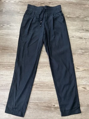 Pantalones Club Monaco plisados con cordón para mujer 6 azul oscuro pierna ajustada longitud completa Foto 1 de 4