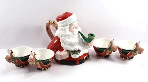 DEPT 56 SANTA TEAPOT WITH LID AND 4 TEACUPS. - Photo 1/7