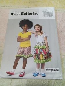 Top, pantaloncini e gonna a giogo Butterick B5777 con volant a strati taglia 6-8 modello non tagliato - Foto 1 di 2