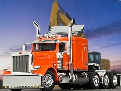 1/64 DCP ORANGE PETERBILT 389 TRI AXLE W/ 63" FLAT TOP SLEEPER & TURBO WING - Image 1 of 4