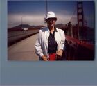 FOUND COLOR PHOTO J+1849 WOMAN IN HAT POSED ON BRIDGE