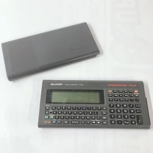 SHARP Komputer kieszonkowy PC-E200 Kalkulator vintage Testowany Japonia - Zdjęcie 1 z 10