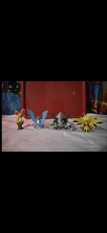 Pokémon Figurines (Fennekin, Articuno, Aggron, Zapdos) Cover