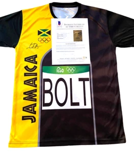 MAGLIA USAIN BOLT FIRMATA RIO OLYMPICS GIAMAICA AUTOGRAFO AUTENTICO BECKETT BAS - Foto 1 di 2
