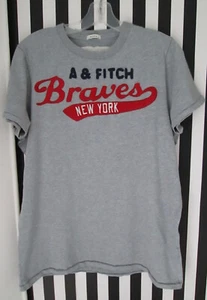 VINTAGE ABERCROMBIE & FITCH BRAVES NEW YORK GRAU MUSKEL T-SHIRT SCHRIFTZUG HERREN GRÖSSE L - Bild 1 von 5