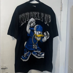 Camiseta de Colección Pato Donald Knuckles Up NUEVA SIN ETIQUETAS-2XL - Imagen 1 de 8