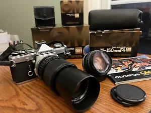 OLYMPUS OM-1n KAMERA MIT 50MM F1.8 & 75-150mm F4 OBJEKTIV * 35MM SPIEGELREFLEXKAMERA KONVOLUT * - Bild 1 von 19