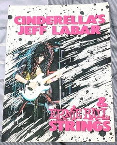 CENICIENTA / JEFF LABAR / 1989 CUERDA DE GUITARRA ERNIE BALL REVISTA ANUNCIO IMPRESO + DVD - Imagen 1 de 1