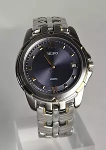 Reloj de cuarzo analógico Seiko 7N42-0AM0 para hombre con adornos dorados de acero inoxidable esfera azul fecha - Imagen 1 de 15