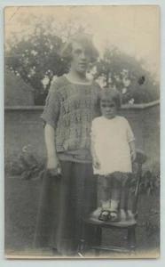 POSTCARD RPPC Of young child standing on a chair, walled garden - Picture 1 of 2