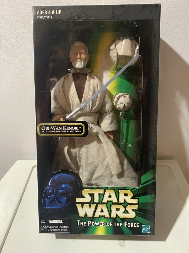 TOMY (FIGURA DE ACCIÓN) OBI-WAN KENOBI / CON SABLE DE LUZ RESPLANDOR EN LA OSCURIDAD 12 pulgadas Foto 1 de 1