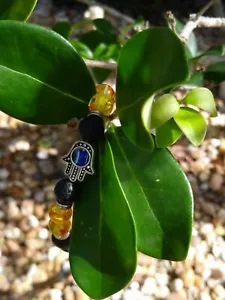 ACEITE ESENCIAL - MAL DE OJO - ELÁSTICO - ROCA DE LAVA NEGRA NATURAL - PULSERA DE PIEDRA - Imagen 1 de 3