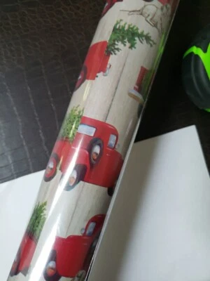 BUY ONE GET ONE FREE Christmas wrapping paper roll Truck Carrying Christmas Tree - Image 1 of 4