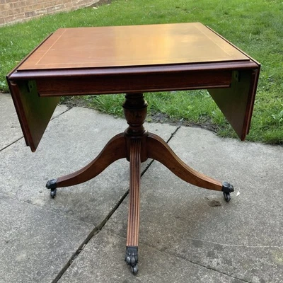 FABULOUS SMALL VINTAGE WOODEN DROP LEAF  TABLE WITH  LION FEET CASTERS - Image 1 of 4