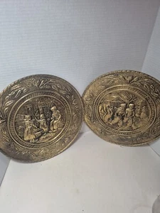 Two Brass Primitive Folk Art Pressed Wall Decor, Netherlands Market/Skaters. - Picture 1 of 12