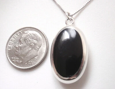 Colgante reversible de madreperla y ónix negro simulado de plata de ley 925 Foto 1 de 4