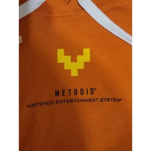 Felpa con cappuccio Nintendo Metroid nuova rara grafica arancione bordo bianco media - Foto 1 di 9