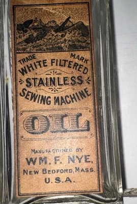 ACEITE DE MÁQUINA DE COSER ANTIGUA DE 1900 CON ETIQUETA DE PAPEL ORIGINAL ERA ACEITE DE ESPERMA Foto 1 de 4