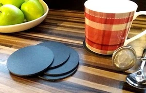4 SOTTOBICCHIERI ROTONDI NERI IN PELLE DIAM 3,5" - Foto 1 di 3