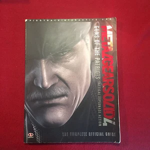 Metal Gear Solid 4 Guns of the Patriote Piggyback Official Strategy Game  - Picture 1 of 3
