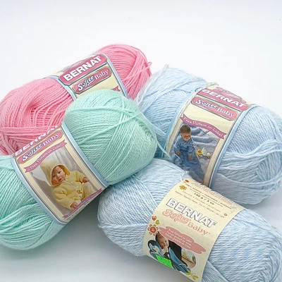 Lot of 4 Bernat Softee Baby Yarn 5oz skeins in Denim Marl, Prettiest Pink, Mint - Image 1 of 4