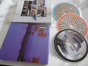 Oasis Stop The Clocks Beste Aus Deluxe 2 CD+DVD Inklusive Heft Außen Schuber - Bild 1 von 1