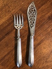 Sterling fish knife and fork set....Walking lion antique set