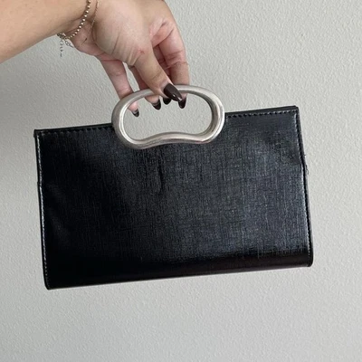 Bolso de mano vintage negro estructurado con mango plateado Foto 1 de 4