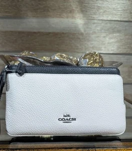 NUEVO CON ETIQUETAS Cartera Muñequera Coach Contraste Doble Cremallera Tiza Blanca y Negra Precio de venta sugerido por el fabricante - $110 NUEVA - Imagen 1 de 2