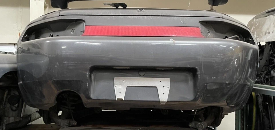 89-95 Porsche 928 S4 GTS Euro OEM Rear bumper with center light reinforcement - Изображение 1 из 1