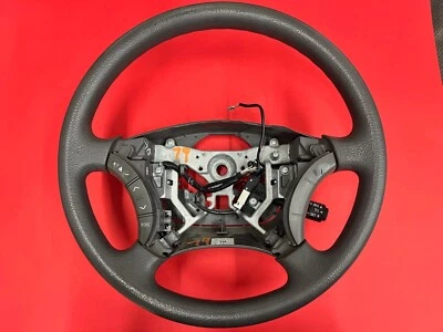 Toyota Camry 2005-2006 vinilo gris volante con crucero y radio OEM usado Foto 1 de 4